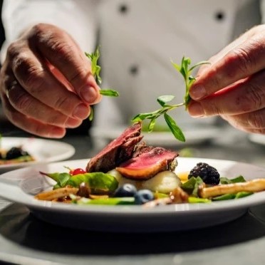 Fine dining at De Flambe, a top-rated restaurant in Islamabad, Pakistan, located in Elysium Tower, Blue Area, offering an exquisite culinary experience and sophisticated ambiance.