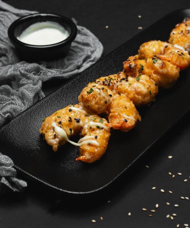 Chilli Garlic Prawns at The De Flambe, a premier restaurant in Blue Area, Elysium Tower, Islamabad – Succulent prawns stir-fried in a spicy, garlicky sauce for an unforgettable flavor experience.