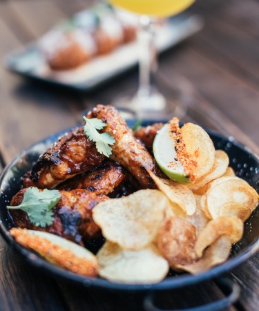 Buffalo Wings at The De Flambe, best restaurant in Blue Area, Elysium Tower, Islamabad – Crispy, spicy wings tossed in tangy buffalo sauce, perfect for a bold appetizer experience.