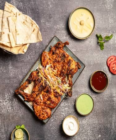Spicy Mutton Chops at De Flambe, a top-rated restaurant in Islamabad near Centaurus and PIMS Hospital. Enjoy tender mutton chops marinated in a flavorful blend of spices, grilled to perfection, perfect for lovers of bold, spicy dishes.