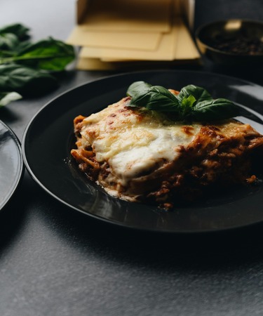 Delicious lasagna served at De Flambe, a premier restaurant located in Elysium Tower, Blue Area, Islamabad. Enjoy this classic Italian comfort food made with layers of pasta, rich meat sauce, and melted cheese. Perfect for food lovers in F7, F8, G7, and G8 areas.